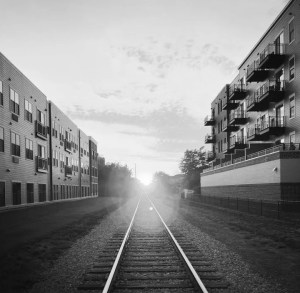 sun from end of train tracks